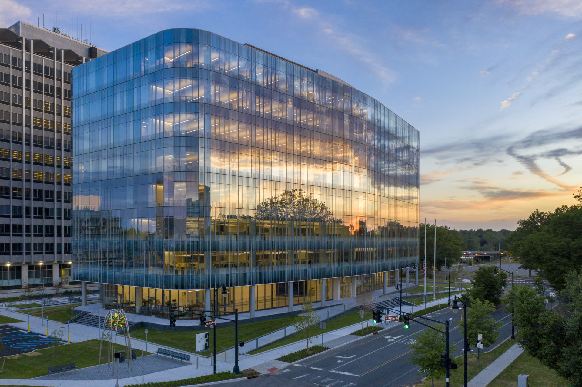 the New Jersey Division of Taxation Building reflecting in the sunset