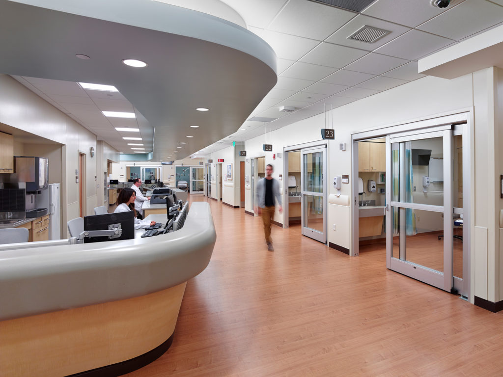 nurses station and patient rooms at emergency care center