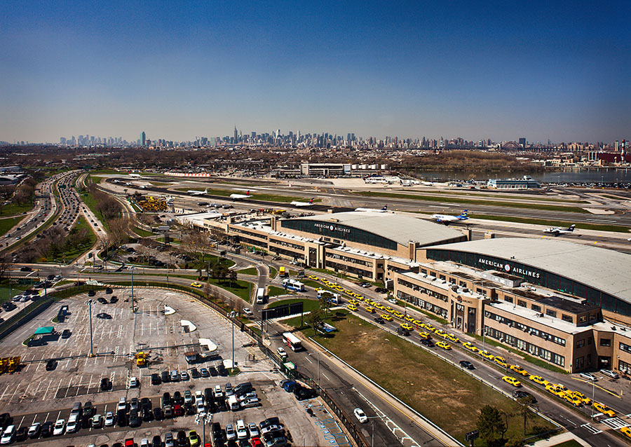 Aerial shot of JFK Airport with New York skyline in the background