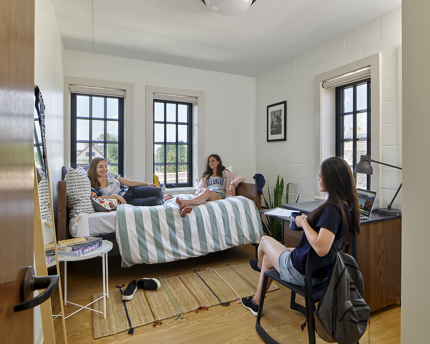single room student housing interior with students at Villanova University