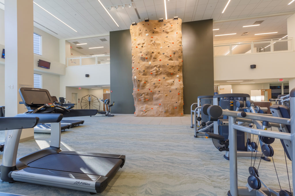 exercise equipment and rock wall at the valley health and wellness center
