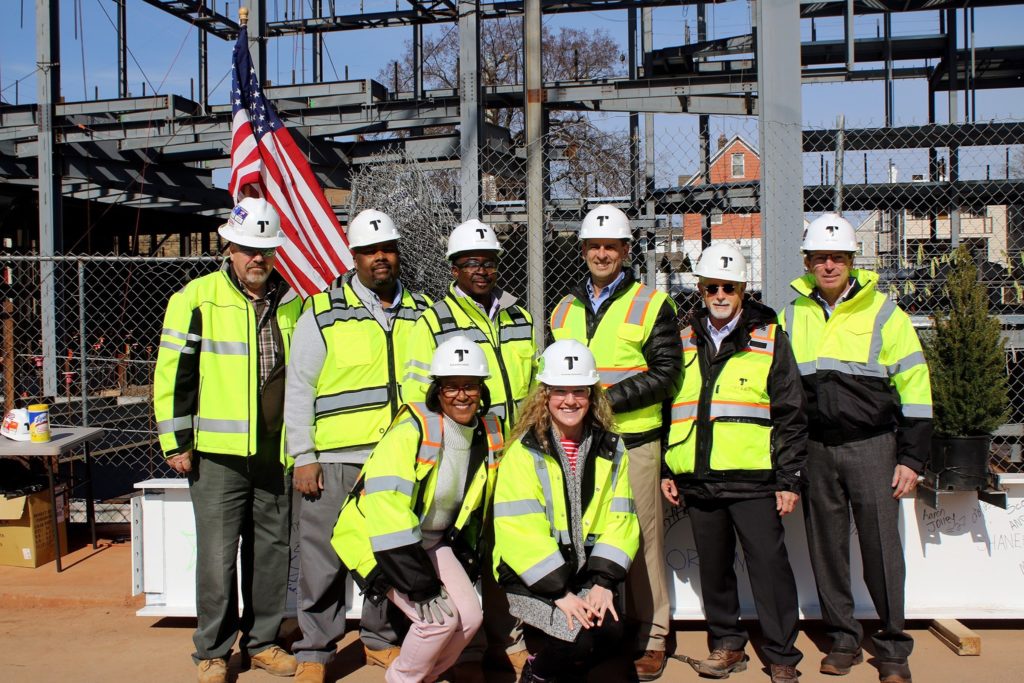 Torcon team wearing hardhats at construction site