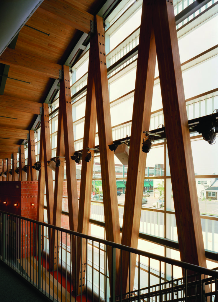 two story glass and timber lobby in two rivers performing arts center
